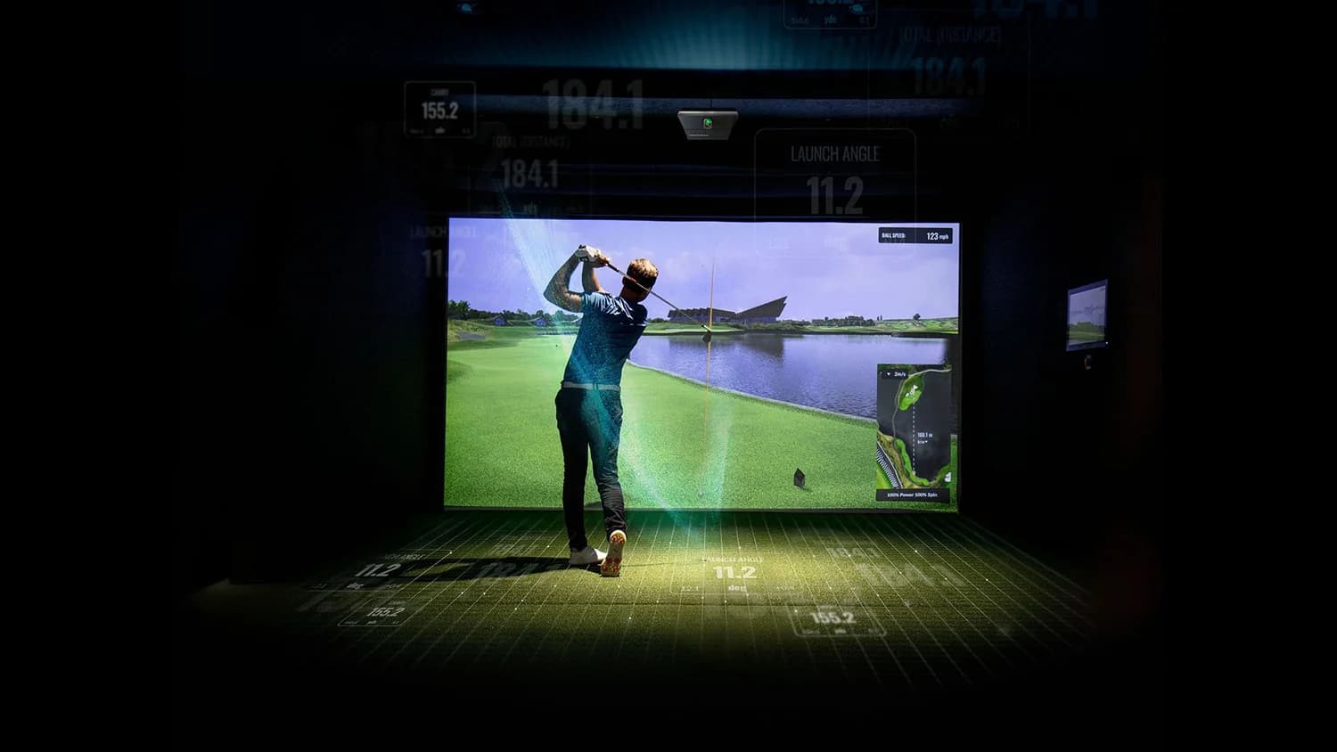 Trackman launch monitor integrated in a custom home golf simulator room