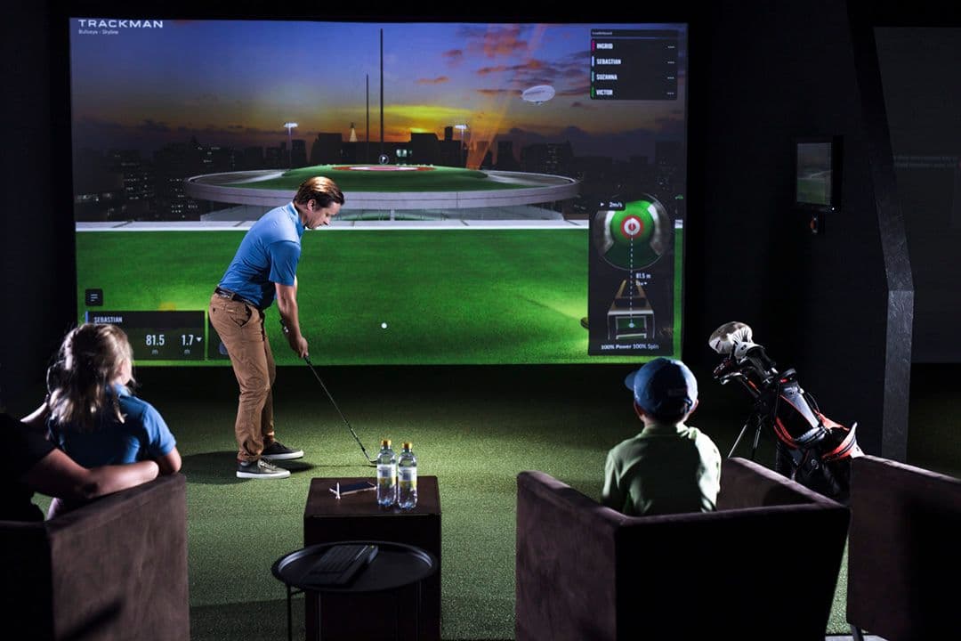 Bespoke luxury home golf simulator lounge design